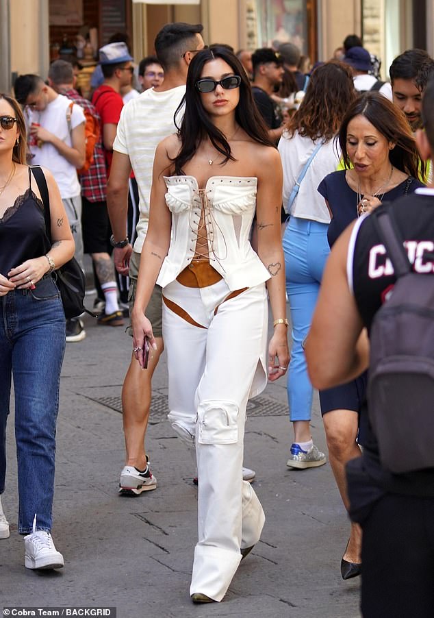 Ciao: Dua Lipa cut a stylish figure as she enjoyed a few days off in Florence on Monday, as she took in a spot of sight seeing on her last day in Italy