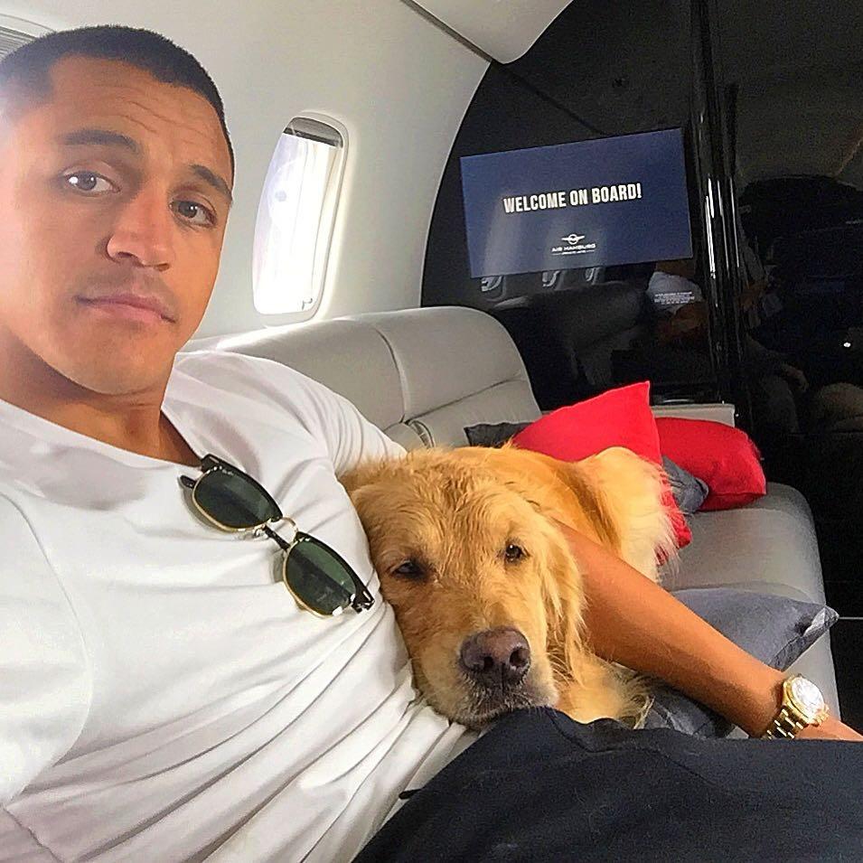  Sanchez cuddles Atom on a private plane