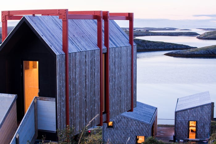 One of the airbnb buildings made out of wood and red metal