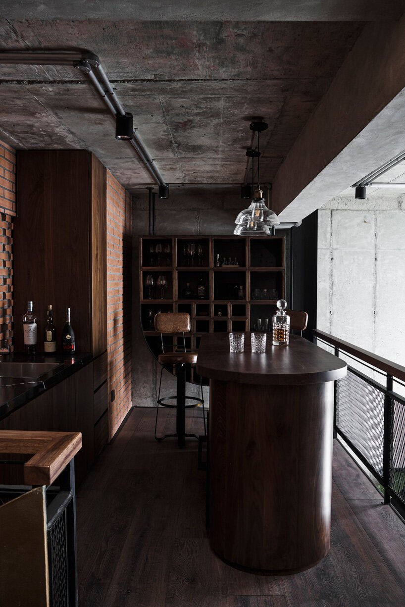 le house renovates penthouse in vietnam with brick, concrete + industrial aesthetics