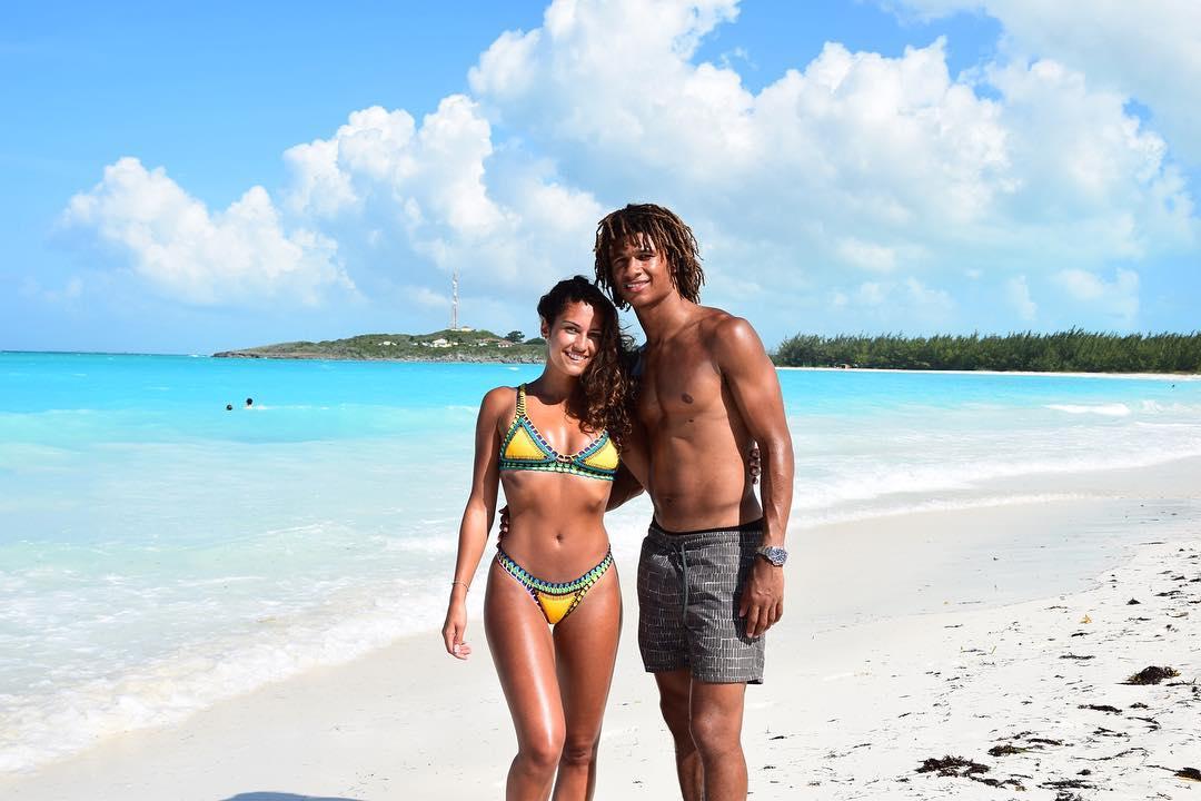  Kaylee Raммan and Nathan Ake enjoy a break in BarƄados