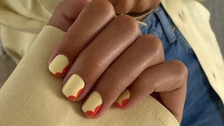 Yellow nails with red accents