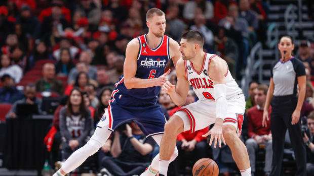 Dec 7, 2022; Chicago, Illinois, USA; Washington Wizards center Kristaps Porzingis (6) defends against Chicago Bulls center Nikola Vucevic (9) during the first half at United Center.